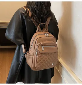 Back view of a stylish brown soft leather women's backpack with quilted detailing