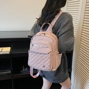 Detailed back view of a pink soft leather backpack with quilted pattern design