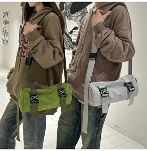 Outdoor-ready green and grey cylinder crossbody bags shown on male and female models