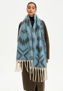 Detailed look at blue faux mohair ethnic jacquard scarf with decorative fringes.