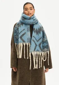 Elegant ethnic jacquard mohair-like blue scarf with thick long tassels detail view