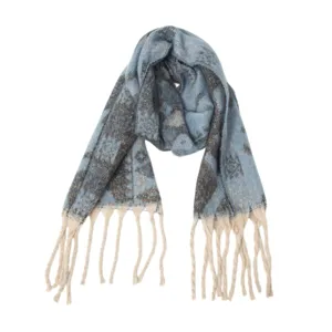 Close-up detail of a blue ethnic jacquard scarf featuring soft texture and stylish tassels