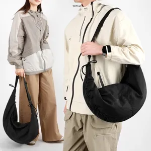 Large capacity black pleated nylon crescent sling bag for men and women, urban outdoor style.