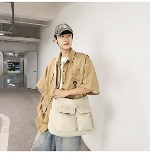 Vintage beige canvas messenger bag with large capacity and front utility pocket details