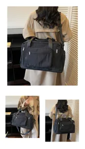 Large capacity black travel duffel bag with multiple pockets for gym and business trips