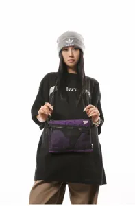 Close-up of a model wearing a purple Japanese streetwear crossbody bag with mesh detail