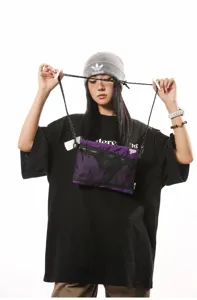 Detailed view of a purple Japanese techwear sacoche crossbody bag for outdoor street use