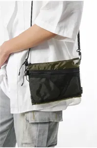 Detailed shot of olive green Japanese workwear crossbody bag with black mesh pocket