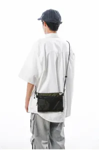 Japanese style outdoor sacoche crossbody bag in olive green with mesh pocket