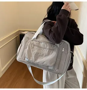Large capacity grey nylon travel duffel bag for gym with multiple storage pockets