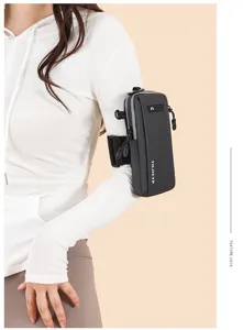 Slim sports arm bag for phone with dual zippers on a model's arm