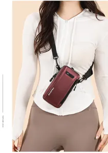 Fashionable maroon mini crossbody phone bag shown on model with white hoodie