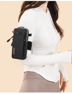 Close-up detail showing a black sports arm bag for phone worn by a model for running