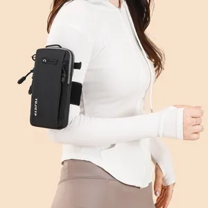 Modern black minimalist sport phone arm bag pouch worn by a model in a white athletic top