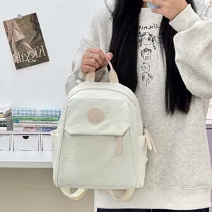 Sac à dos blanc décontracté pour femmes pour l'école et les voyages, style moderne