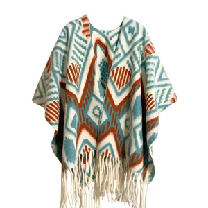 Bohemian geometric pattern knit shawl poncho with fringe detail and rust teal print