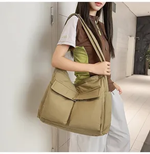 Large khaki padded messenger bag with functional multi-pocket design shown on model