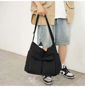 Large capacity black canvas messenger bag for university students, durable shoulder bag