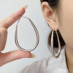 Oversized silver teardrop hoop earrings for women, minimalist geometric design