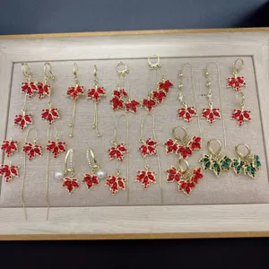 Exquisite collection of red maple leaf earrings with rhinestones and gold tassels.