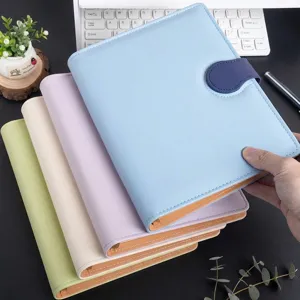 Close-up of colorful PU leather mini planners with magnetic buckle in a stack