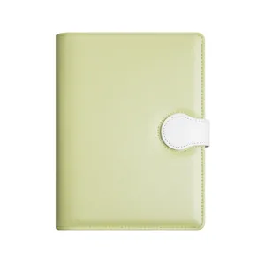 Portable pale green PU leather mini planner with a white magnetic buckle closure