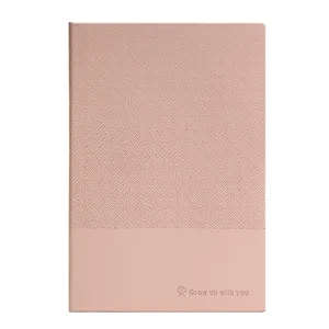 Elegantes Notizbuch aus rosa Kunstleder mit Vintage-Textur und Grow up with you Slogan