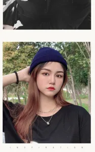 Modella asiatica che indossa un berretto corto in maglia blu scuro all'aperto.