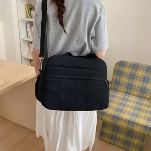 Detailed back view of a large black travel fitness bag with shoulder strap