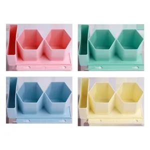 Porte-stylo mural hexagonal et organisateur de bureau en quatre couleurs pastel variées.