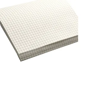 Detailed view of a thick square grid scratch paper notebook featuring clean white pages