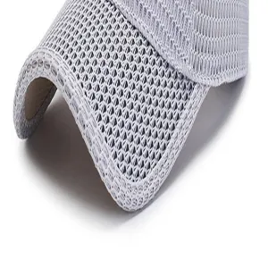 Macro view showing the breathable mesh texture of a summer sun protection baseball cap