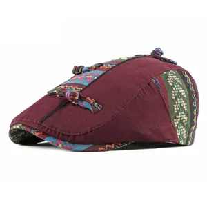 Ethnic style maroon beret hat with colorful woven patterns and decorative knots for women