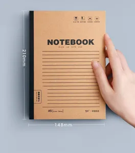 Close-up of A5 kraft paper notebook held by hand showing 210x148mm dimensions