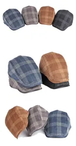 Detailed view of plaid corduroy flat caps in various colors including blue and tan