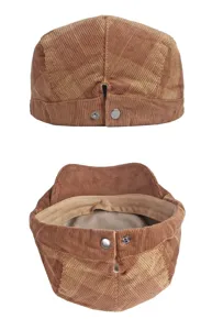 Detailed view of brown corduroy flat cap featuring adjustable back snaps and interior lining