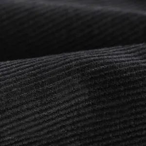 Macro detail showing the soft texture of black corduroy fabric for winter beret hats