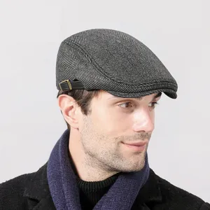 Classic grey herringbone patterned flat cap for autumn and winter warmth and style