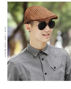 Close-up of man wearing a breathable brown mesh beret hat in an outdoor setting.