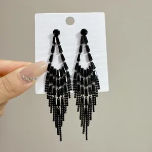 Elegant long black tassel fringe earrings with shimmering multi-layered gem detailing
