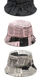 Unisex newspaper print bucket hats available in pink, black, and white for sun protection.
