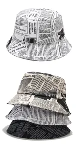 Trendy bucket hats with vintage newspaper print in white, beige, and black colorways.