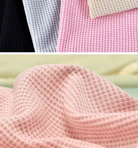 Close-up detail of soft breathable waffle knit fabric for beanie hats