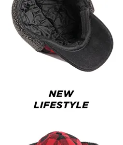 Detailed view of the warm quilted lining in a red and black plaid winter cap.