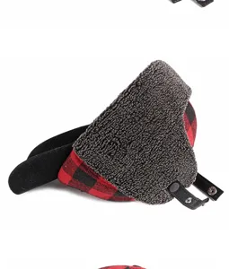 Close-up of a winter fleece-lined baseball cap featuring red plaid and protective ear flaps