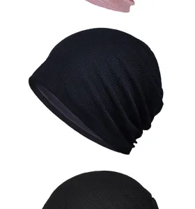 Detail view of the waffle knit slouchy beanie featuring soft and breathable fabric texture