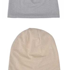 Detailed macro view of soft waffle knit texture on breathable elastic slouchy beanie hats