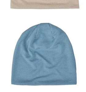 Close-up of soft blue waffle knit beanie hat with breathable textured fabric detail