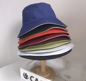 Detailed stack of colorful reversible bucket hats in various vibrant shades