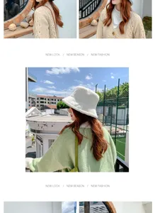 Chic white faux fur bucket hat for women's winter warmth and stylish outdoor look